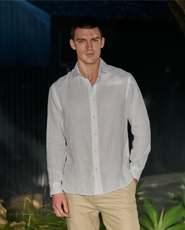 Man in a white linen shirt. Casual shirts and polos 30 percent off.