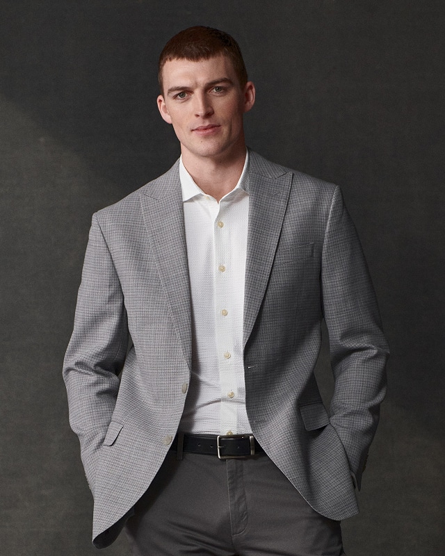 Man in a grey sport coat. Sport coats 30 percent off.