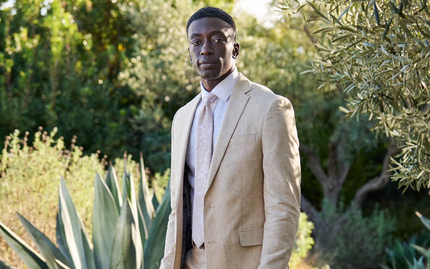 Man in a linen suit outdoors. Flash sale up to 50 percent off sitewide.