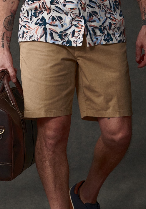 Khaki shorts and floral shirt. Pants and shorts up to 40 percent off.