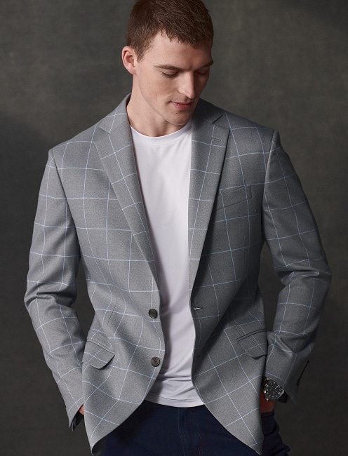 Man in a grey windowpane sport coat. Sport coats 30 percent off.