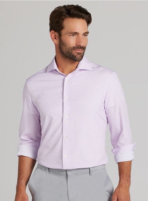Man in a lavender dress shirt with sleeves rolled up. Clearance dress shirts.