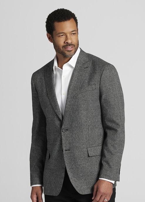 Man in a grey plaid sport coat over a white dress shirt. Clearance sport coats.