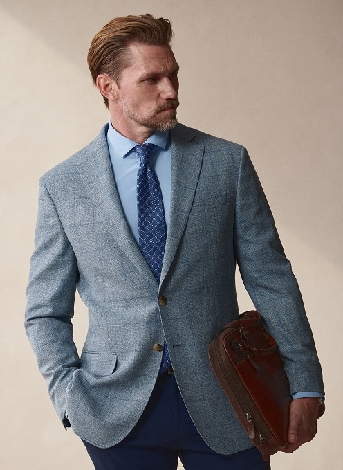 Man in a light blue sport coat. Sport coats 30 percent off.