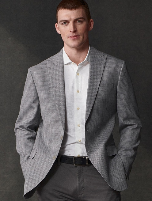 Man in a grey sport coat and white shirt. Online only sport coats 30 percent off.