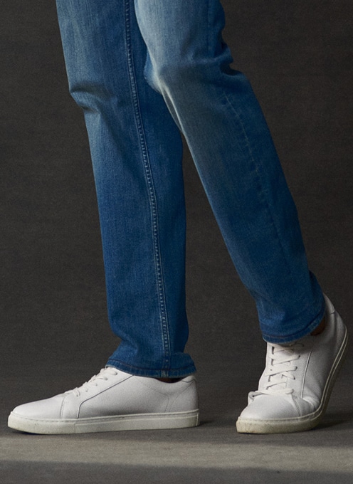 Blue jeans and white sneakers. Online only shoes 30 percent off.