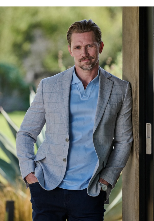 Man in a grey sport coat and light blue polo. Online only sport coats 30 percent off.