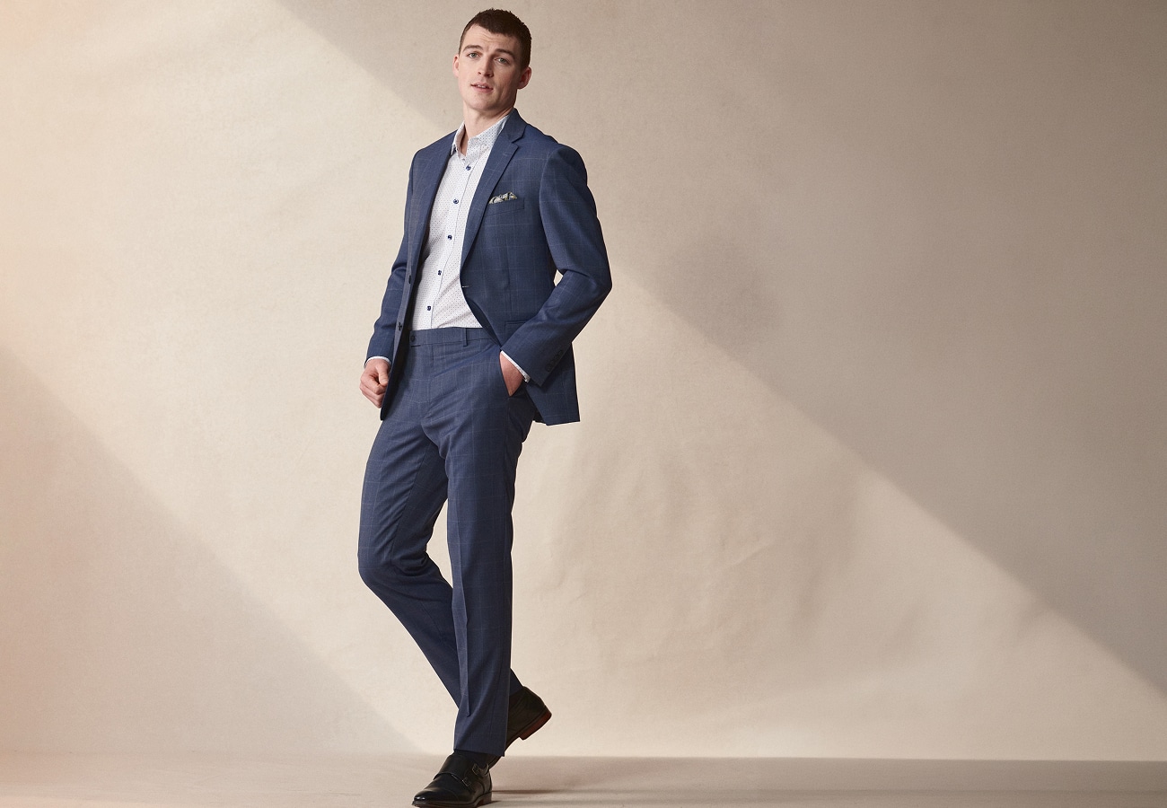 Man in a navy suit. Fourth of July sale up to 40 percent off.