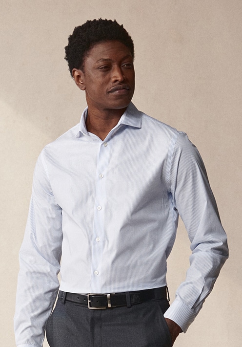 Man in a white dress shirt and tie. Dress shirts up to 30 percent off.