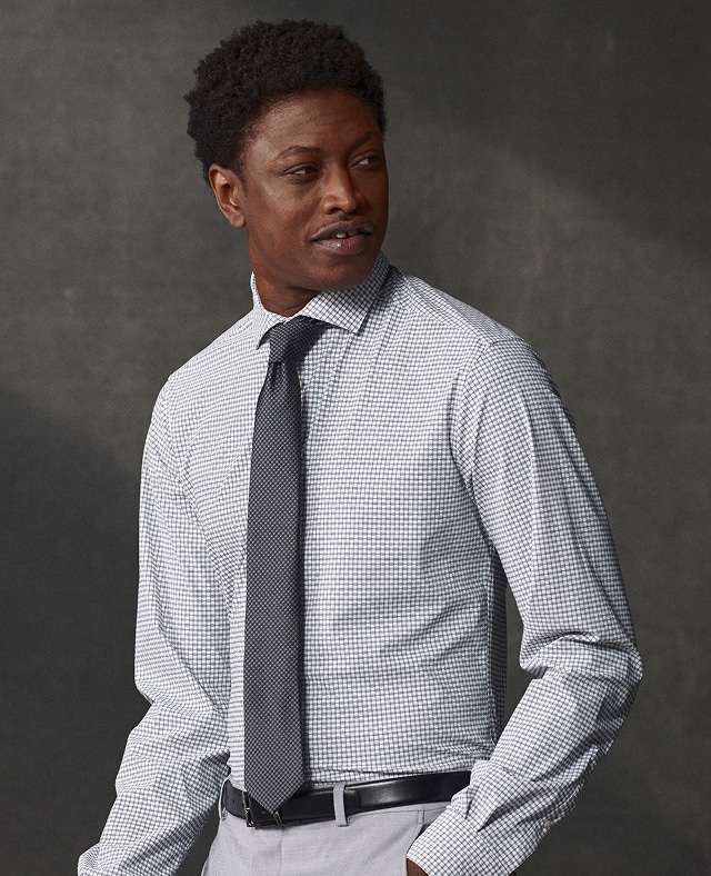 Man in a checked dress shirt and tie. Accessories buy 1 get 1 50 percent off.