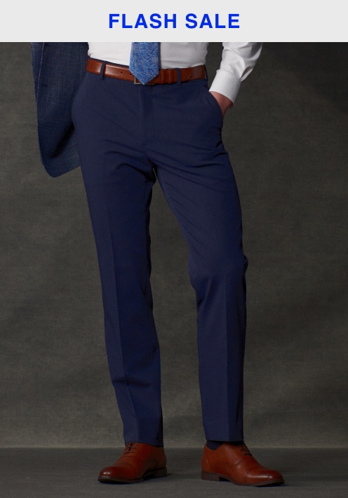 Flash sale. Man in navy dress pants with a belt and dress shirt. Pants and shorts 30 percent off.