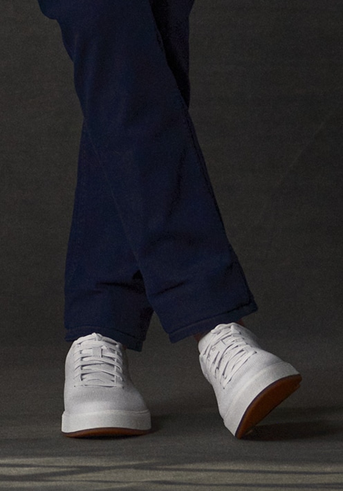 Navy pants and white sneakers. Shoes 30 percent off.
