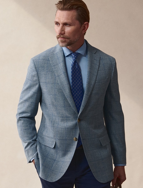 Man wearing a light blue sport coat.