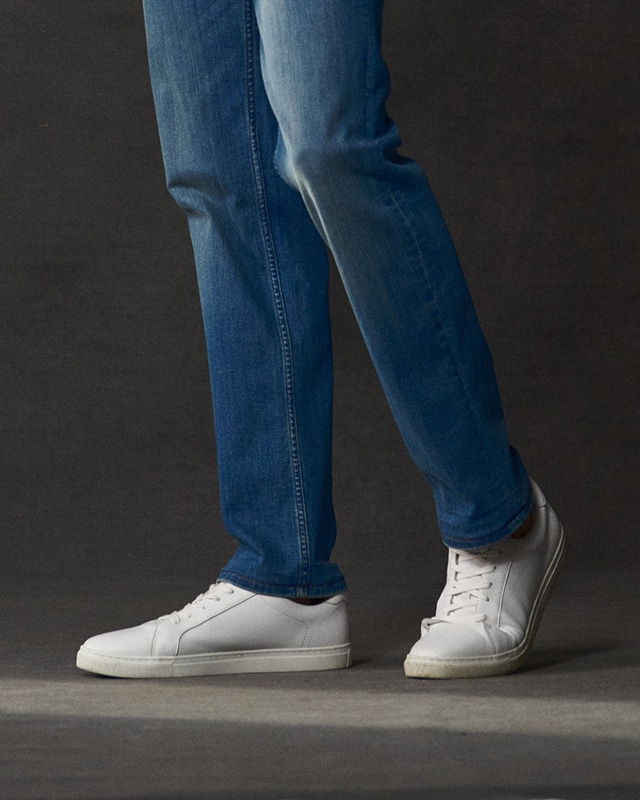 White sneakers and navy pants. Shoes 25 percent off.