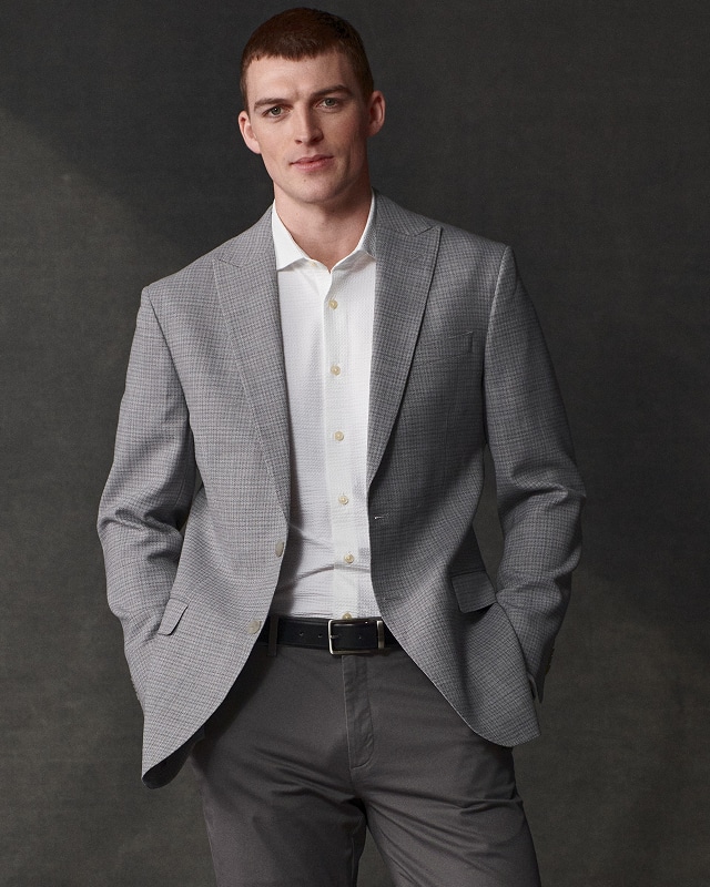 Man wearing a grey sport coat. Sport coats 30 percent off.