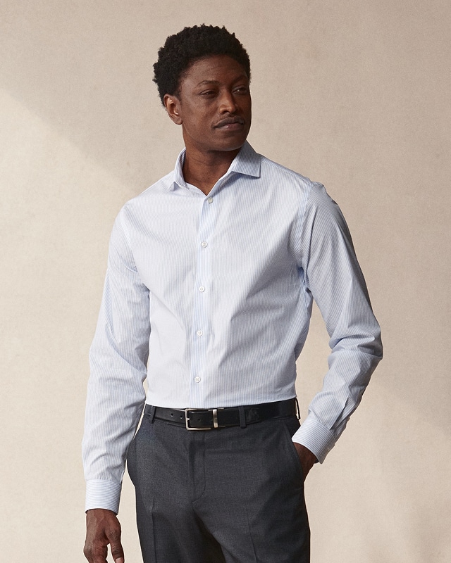 Man wearing a striped dress shirt. Dress shirts 30 percent off.