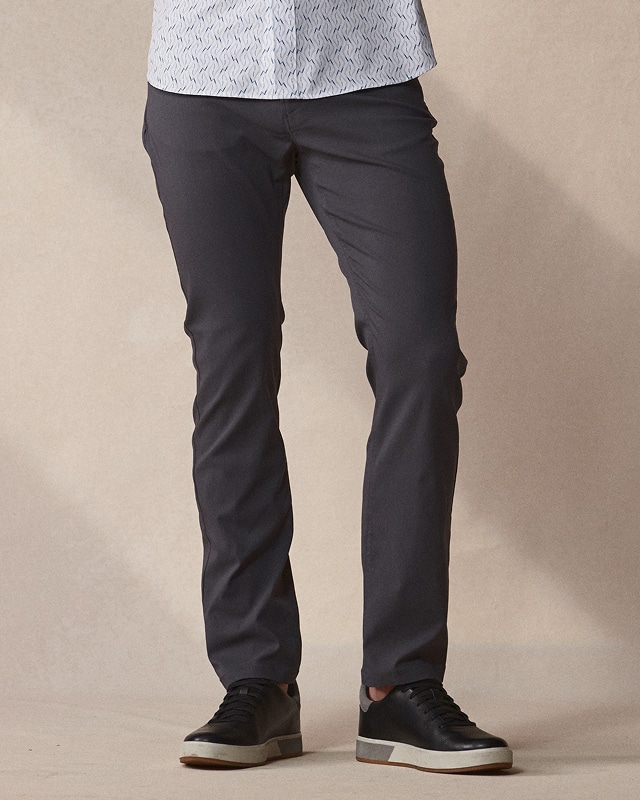 Man wearing charcoal pants. Pants and shorts up to 30 percent off.