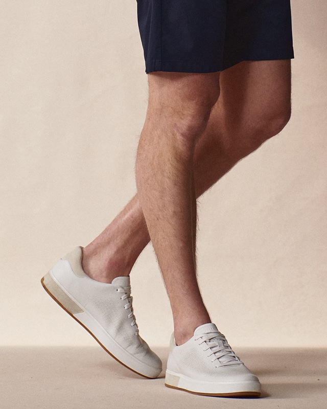 White sneakers and navy shorts. Shoes 30 percent off.