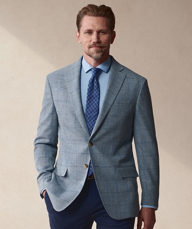 Man wearing a light blue checked sport coat. Sport coats 30 percent off.