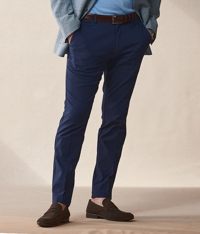 Navy dress pants and brown loafers.