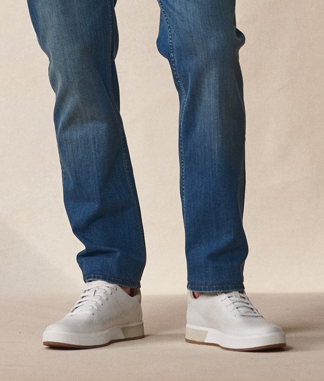 White sneakers and jeans.