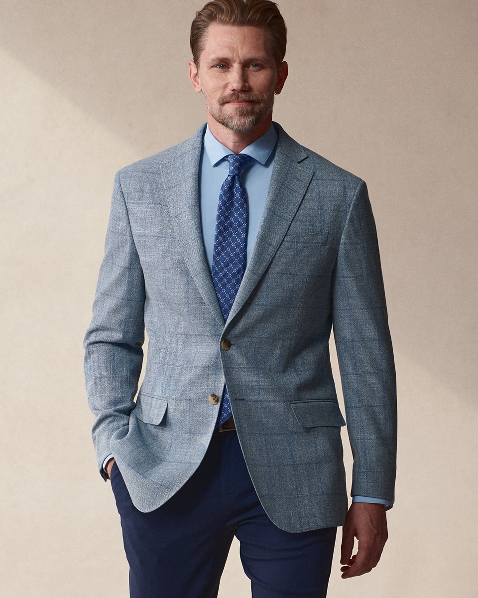 Man wearing a light blue sport coat.