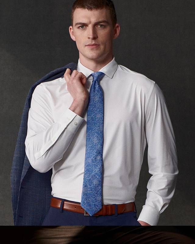 Man wearing a white dress shirt and tie.