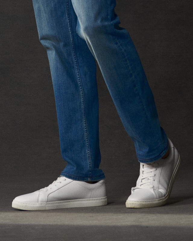 White sneakers and jeans.