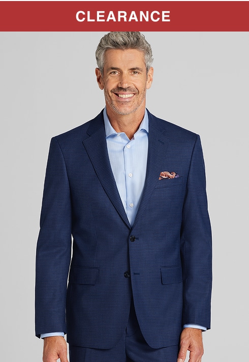 Clearance. Man in a navy suit and light blue dress shirt.