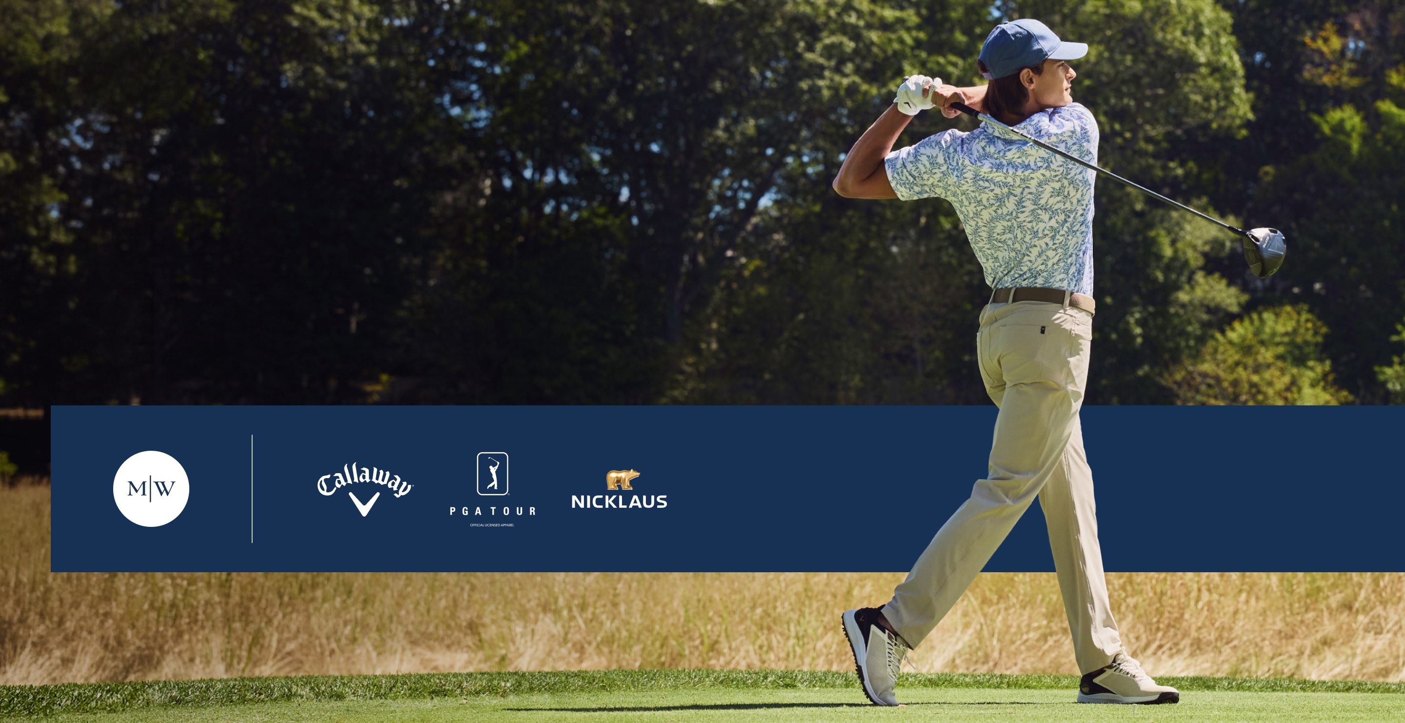 Golfer mid-swing on the course wearing men’s golf apparel