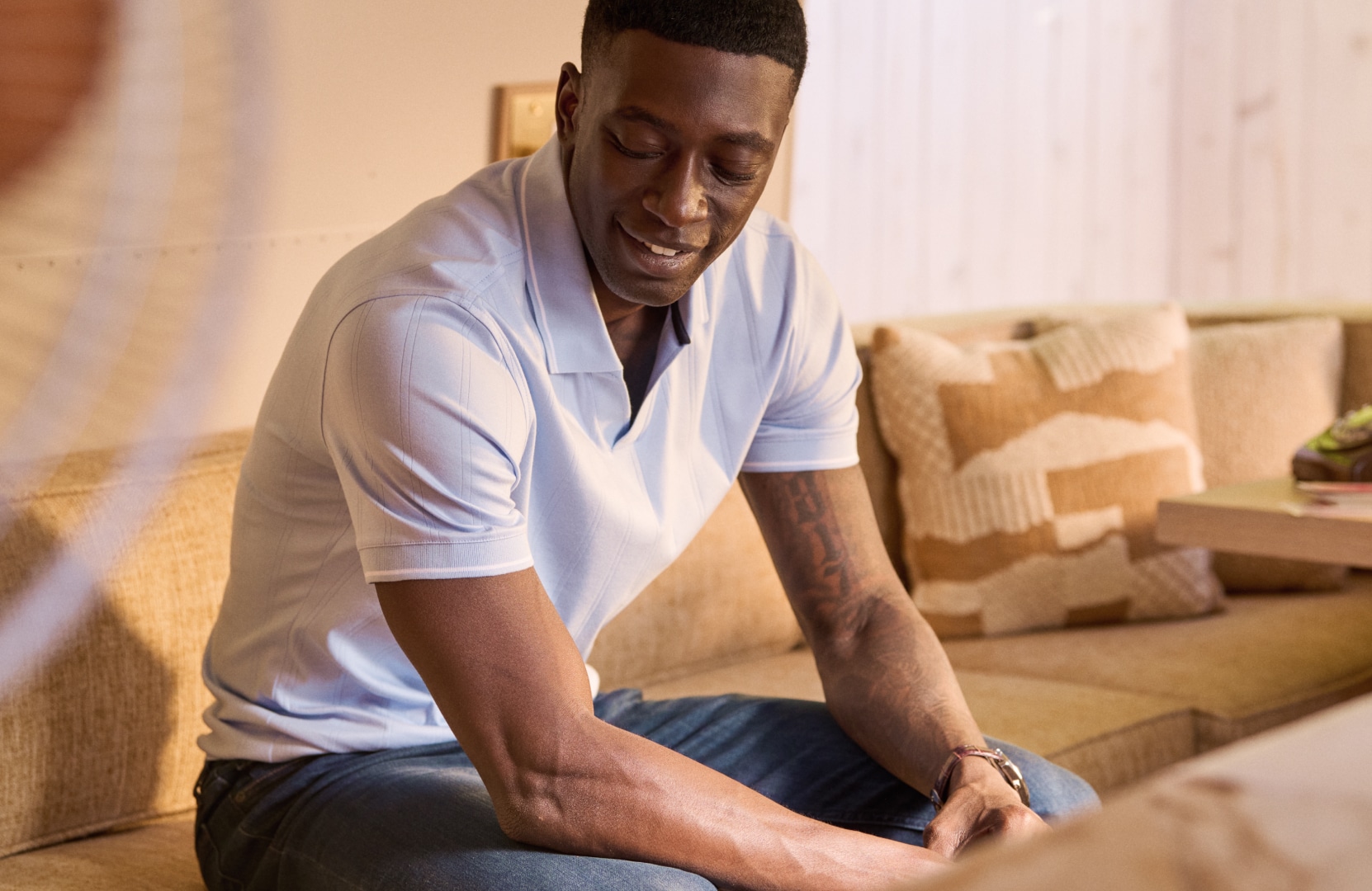 Man wearing a casual polo shirt, lifestyle setting