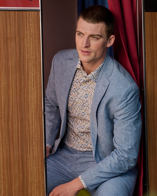 Summer wedding ready. Guest in a light blue linen suit.