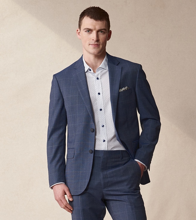 Man wearing a blue windowpane suit.